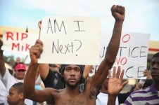 453619428-demetrus-washington-joins-other-demonstrators.jpg